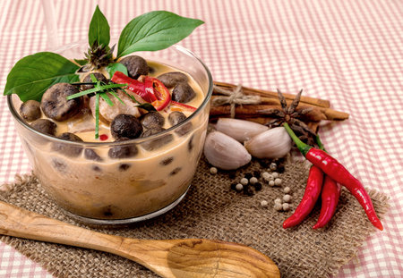 Thai Food Red Curry pork with Bamboo Shoots and mushroom with ingredients on a meal.の写真素材