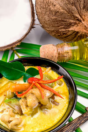 Hot coconut chicken soup with chili and curry In a bowlの写真素材