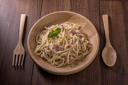 Spaghetti carbonara on the plate spaghetti concept on woodenの写真素材