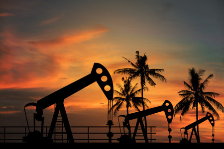 Oil pump oil rig energy industrial machine for petroleum in the sunset background for design