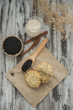 cookies with sesame seeds and glass of milk, homemade sweet cookiesの写真素材