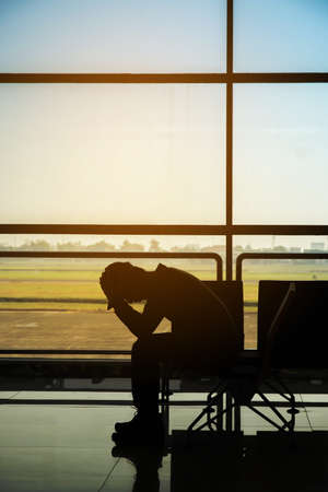 Man in airport. Airplane, view from airport terminal.selective focus,travel concept.の写真素材
