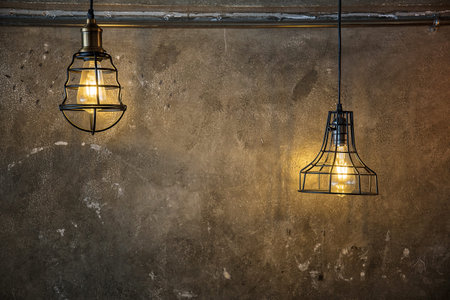 Illuminated retro style light bulbs. Trendy design, Beautiful hanging light bulbs on Plaster wall...