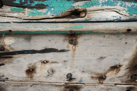 Old wooden boat wall background, Close up of wall with layers of chipping paint flakesの写真素材