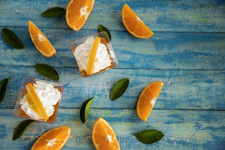 Orange jam in glass jar, selective focus, Fruit jelly with fresh oranges.