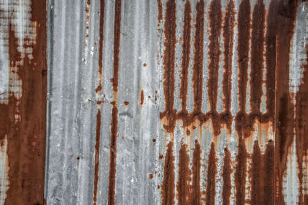 old rusty galvanized, corrugated iron siding vintage texture background, Rusty corrugated metal wall.の写真素材