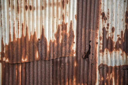 old rusty galvanized, corrugated iron siding vintage texture background, Rusty corrugated metal wall.の写真素材