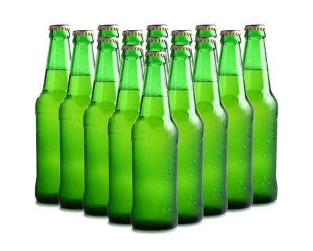 beer's bottles with frosty drops isolated on white background