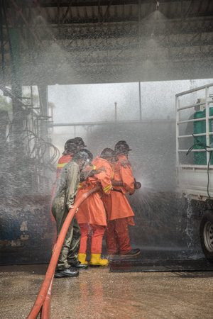 Firefighters rehearse fire fighting plans at LPG storage facilities. Thailand.