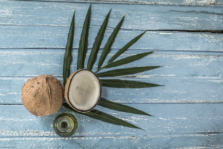 fresh coconuts on old wooden table.の写真素材