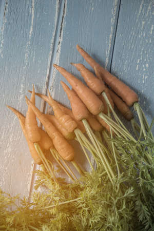 Fresh and sweet carrot on wooden table, Healthy food.の写真素材