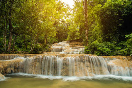 soft water of the stream in the natural park, Beautiful waterfall in rain forest ( Maekae Waterfall, Thailand)の写真素材