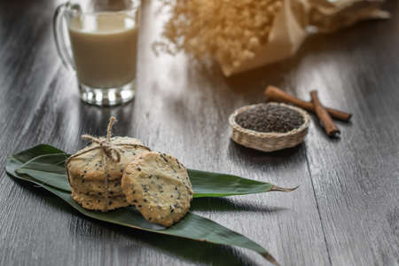 cookies with sesame seeds and glass of milk, homemade sweet cookiesの写真素材