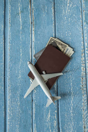 Tourist travel planning concept on wood with passport, airplane, Travel Conceptの写真素材