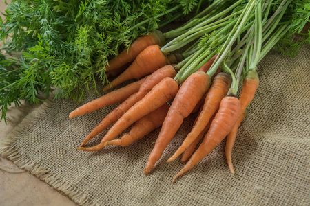 Fresh and sweet carrot on wooden table, Healthy food.の写真素材