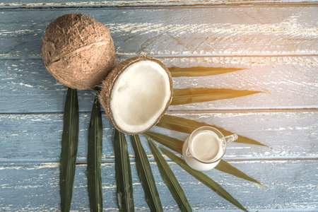 fresh coconuts on old wooden table.の写真素材