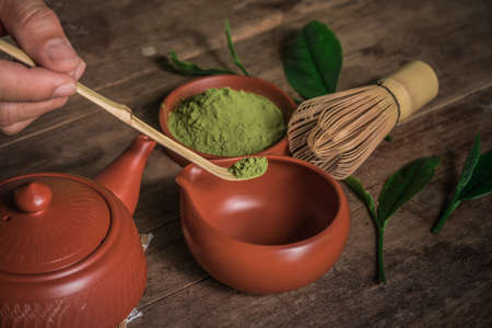 Brewing green tea powder, Still life with Japanese matcha accessories and green tea in bowl.の写真素材