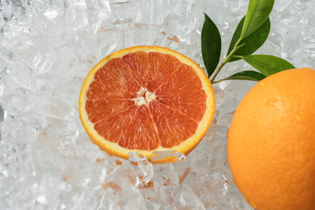 Fresh oranges in ice, close up view.の写真素材