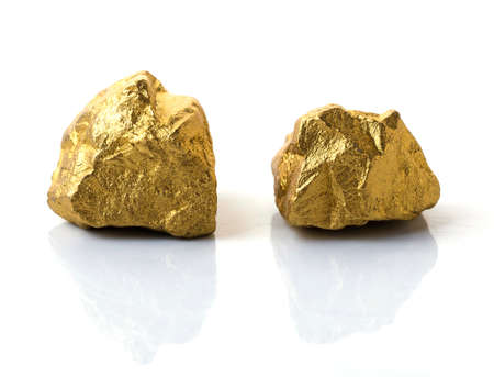 mound of gold close-up isolated on white backgroundの写真素材