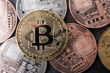 Lot of golden bitcoin coins - virtual money of the worldの写真素材