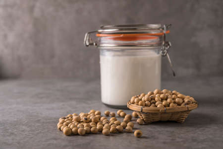 Soybeans and milk in soft focus backgroundの写真素材