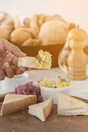 toasts with hard boiled eggs and mustard, preparing healthy breakfast,の写真素材