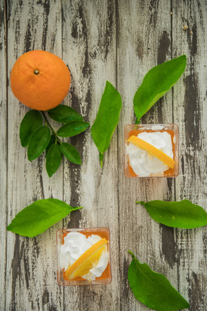 Orange jam in glass jar, selective focus, Fruit jelly with fresh oranges.の写真素材