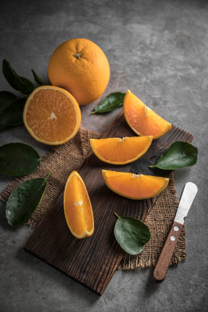 Beautiful, fresh orange on the dark background. Healthy sweet food concept. Mock up for fruits...