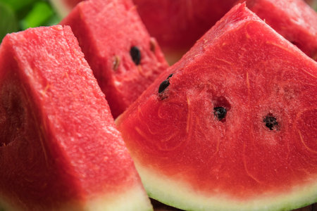 Fresh sliced watermelon wooden background, Slices of watermelons on cutting board
