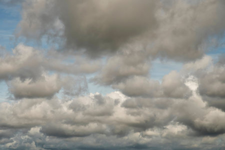 Light in the Dark and Dramatic Storm Clouds background, Black cumulus clouds before the beginning of...
