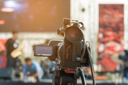 Video production covering event on stage by professional video camera in outdoor concert.の写真素材