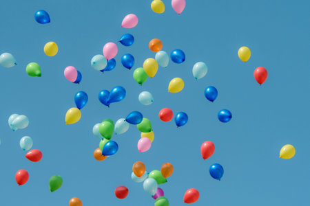 Rubber balloon with blue sky, rainbow ballons in the sky