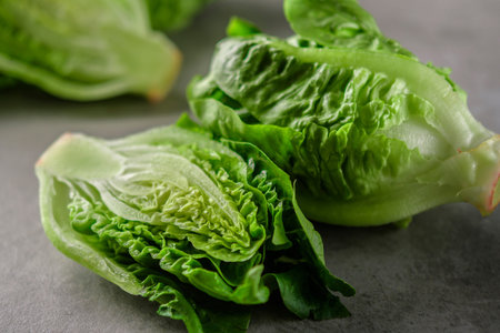 Romaine lettuce salad over stone table.