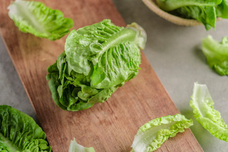 ripe organic green salad Romano on a cutting board.