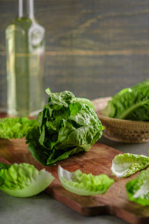 ripe organic green salad Romano on a cutting board.の写真素材