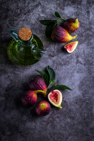 Fresh ripe figs on dark table. Healthy mediterranean fig fruit. Fresh figs on black background. Beautiful blue violet figs with empty copyspace close upの写真素材