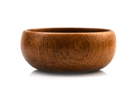 Wooden bowl isolated on white background.