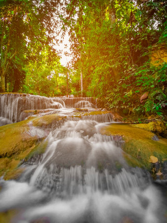 soft water of the stream in the natural park, Beautiful waterfall in rain forest ( Maekae Waterfall,...