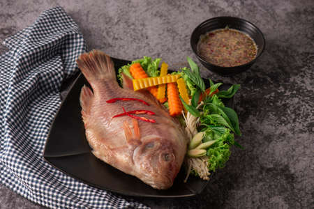 snapper fish steamed with soy sauce with ingredientの写真素材