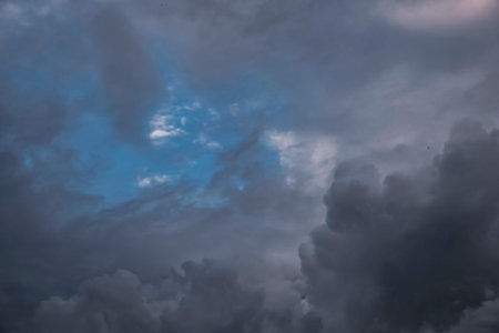 Before heavy rain storm. On the sky is covered all over by the clouds. A lot of lightning and strong...