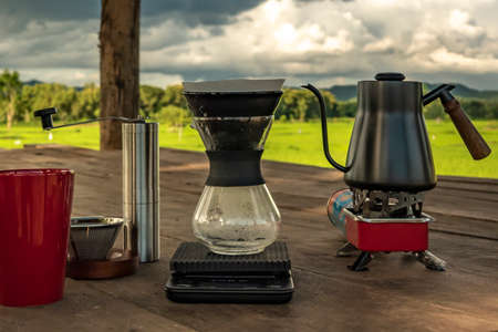 drip coffee with filter in morning on beautiful rice fields view.の写真素材