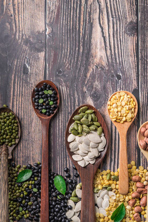 Mix of nuts in wooden spoon, Nuts mix on a wooden background