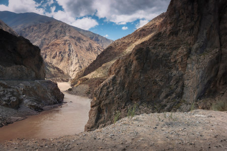 Beautiful road in 216 Sheng Dao Daocheng Xian, Ganzi Zangzuzizhizhou, Sichuan Sheng, China. Moto travels in North China, a fantastic Canyon view on a cloudy day.の写真素材