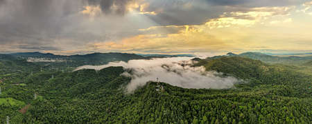 Aerial view, Beautiful Panorama landscape sunrise over peak Mountain with warm light sunrise Mae Moh Lampang, Thailand.の写真素材