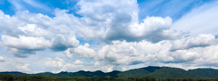 blue sky background with tiny clouds. panorama, Wide sky panorama with scattered cumulus clouds,...