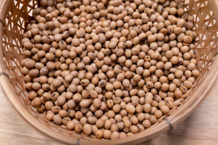 Raw soybean seed food organic top view texture, High in fiber, helps prevent cancer, supplementary food, Protein healthy food, Close-Up Shot of Soybean Falling, slow motion.の写真素材