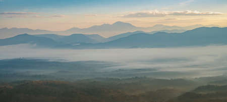 Mountain with white mist in morning sunrise, nature landscape. Beautiful mountain with white mist in morning sunrise, nature landscape.の写真素材
