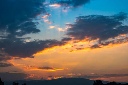 Beautiful sunset sky clouds with dramatic light,  dramatic sunset over a cloudy sky, evening outdoor background, Twilight sky with Colorful, Background of colorful sky concept sunset and sunrise.の写真素材