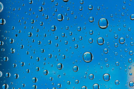 water drop on blue backgroundの写真素材