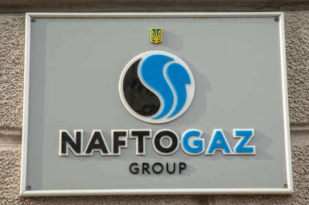 Kyiv / Ukraine - July 31, 2020: Naftogaz group plate signboard on a stone facade. Gray sign plate of naftogaz group company on stone facadeのeditorial素材